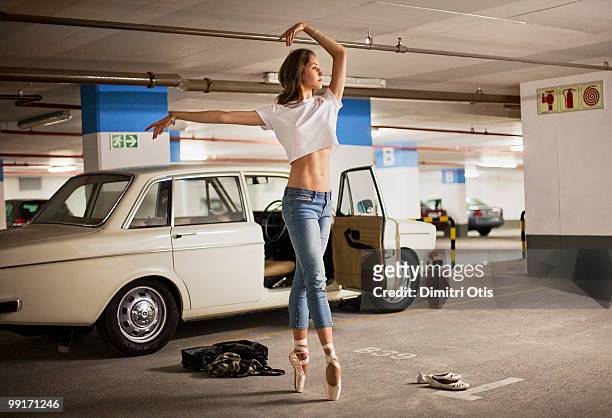 ballerina practising in parking lot - bizarr stock pictures, royalty-free photos & images