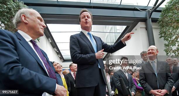 Britain's new Business Secretary, Vince Cable and Conservative Minister of State for Universities and Science, David Willets listen as new...