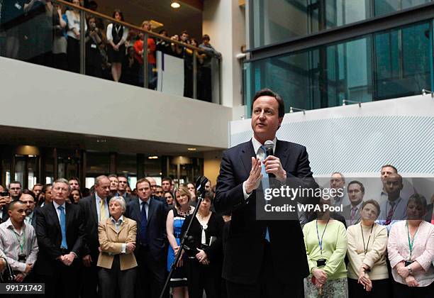 Prime Minister David Cameron talks to civil servants during a visit to the Home Office on May 13, 2010 in central London. Britain's new Conservative...