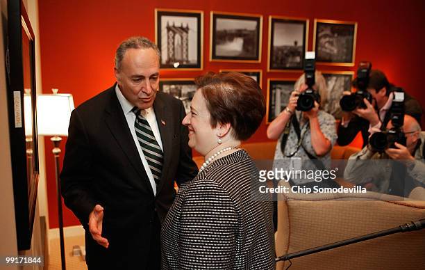 Sen. Charles Schumer shows U.S. Solicitor General and Supreme Court nominee Elena Kagan a photograph hanging on the wall in his personal office in...