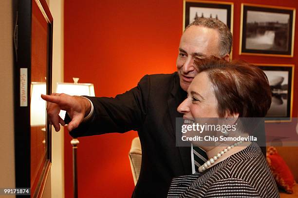 Sen. Charles Schumer shows U.S. Solicitor General and Supreme Court nominee Elena Kagan a photograph hanging on the wall in his personal office in...