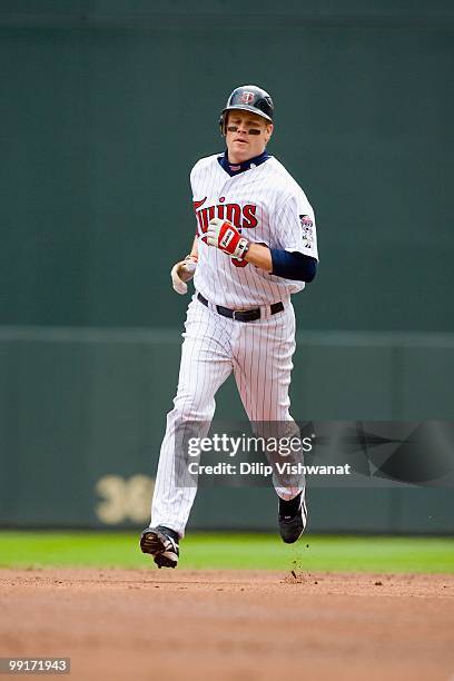 Justin Morneau of the Minnesota Twins rounds the bases against the Baltimore Orioles at Target Field on May 8, 2010 in Minneapolis, Minnesota. The...