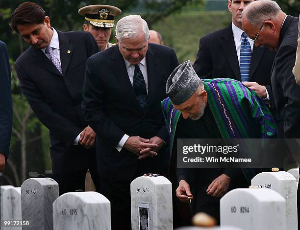 During a tour of Section 60 at Arlington National Cemetery with U.S. Secretary of Defense Robert Gates , Afghanistan President Hamid Karzai visit the...