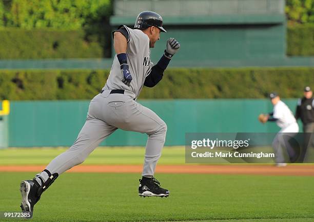 Derek Jeter of the New York Yankees runs to first base against the Detroit Tigers during the game at Comerica Park on May 10, 2010 in Detroit,...