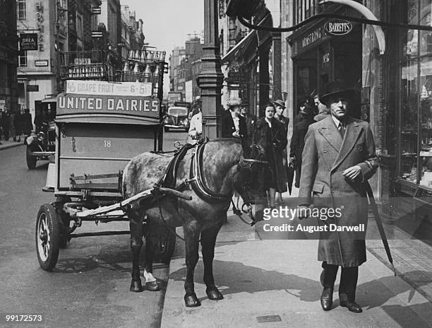 Horsedrawn milk float in Bond Street, London, May 1939. Original publication: Picture Post - 67 - Bond Street - pub. 20th May 1939