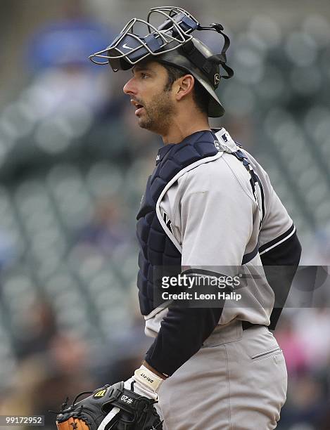 Jorge Posada of the New York Yankees looks on during the game against the Detroit Tigers on May 12, 2010 at Comerica Park in Detroit, Michigan. The...