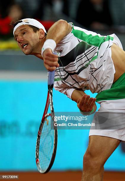 Jurgen Melzer of Austria serves against Fernando Verdasco of Spain in their third round match during the Mutua Madrilena Madrid Open tennis...