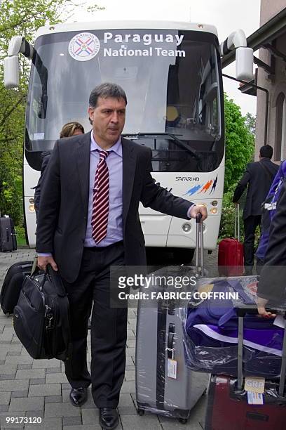 Paraguay's football team coach Gerardo Martino leaves the bus upon the team's arrival on May 13, 2010 at their hotel in Chexbres. Paraguay starts...