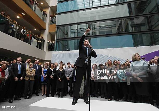 Britain's new Prime Minister David Cameron points as he delivers a speech during a visit at the Home Office in central London, on May 13, 2010....