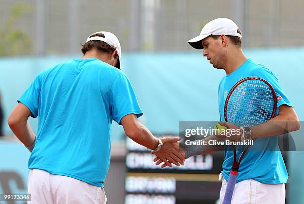 Bob Bryan and Mike Bryan of the USA celebrate a point against Benjamin Becker of Germany and Marco Chiudinelli of Switzerland in their second round...