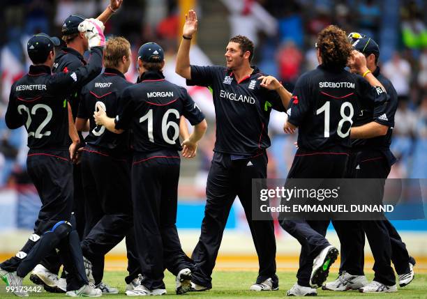 English bowler Tim Bresnan celebrates with teammates after taking the wicket of Sri lankan batsman Tillakaratne Dilshan during the ICC World Twenty20...