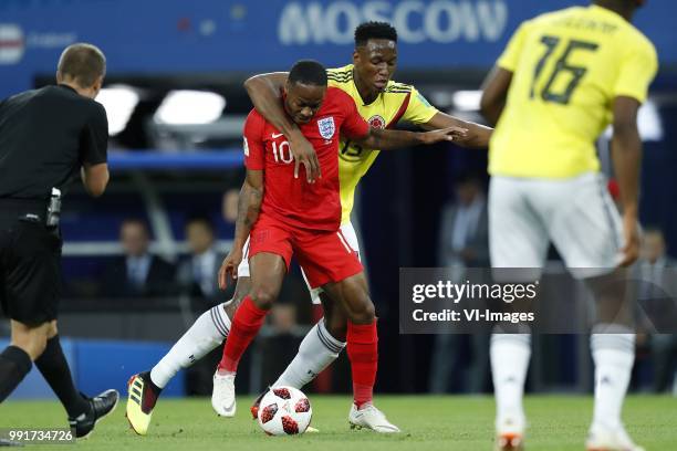 Referee Mark Geiger, Raheem Sterling of England, Yerry Mina of Colombia during the 2018 FIFA World Cup Russia round of 16 match between Columbia and...