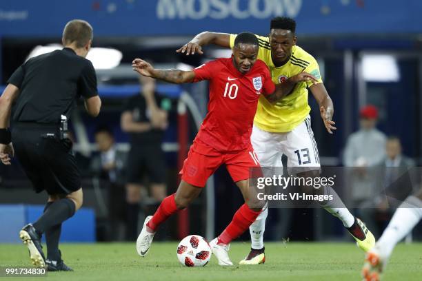 Referee Mark Geiger, Raheem Sterling of England, Yerry Mina of Colombia during the 2018 FIFA World Cup Russia round of 16 match between Columbia and...
