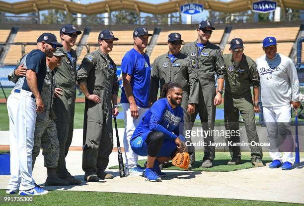 Members of the Air National Guard 144th Fighter Wing ground crew pose for a photo with Chris Woodward, Bob Geren, Kenley Jansen and manager Dave...