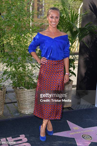 Sina Tkotsch attends the Riani show during the Berlin Fashion Week Spring/Summer 2019 at ewerk on July 4, 2018 in Berlin, Germany..