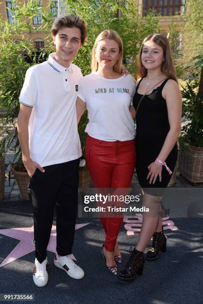 Lukas Rieger, Anne Sophie Briest and her daughter Faye Montana attend the Riani show during the Berlin Fashion Week Spring/Summer 2019 at ewerk on...