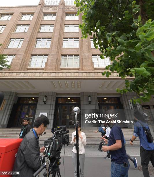 Media reporters gather in front of the Education Ministry after a senior official Futoshi Sano was arrested by Tokyo Prosecutors Office on suspicion...