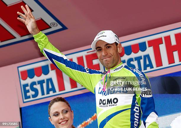Italian Vincenzo Nibali clebrates before putting on the pink jersey of leader on the podium after the fifth stage of the 93rd Giro d'Italia going...