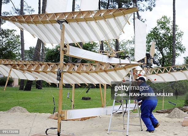 Member of "Flyersteam" old aircraft association Marc Bulin checks the aerofoils of "Le Canard" French first seaplane replica, on May 13, 2010 in...