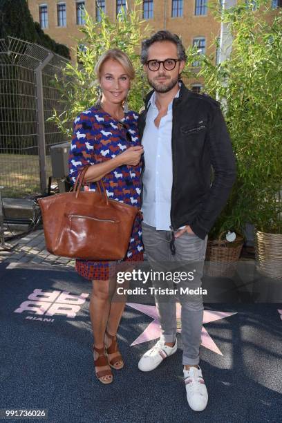 Caroline Beil and her boyfriend Philipp Sattler attend the Riani show during the Berlin Fashion Week Spring/Summer 2019 at ewerk on July 4, 2018 in...