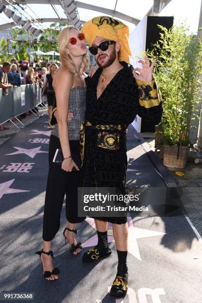 Mandy Bork and Riccardo Simonetti attend the Riani show during the Berlin Fashion Week Spring/Summer 2019 at ewerk on July 4, 2018 in Berlin,...