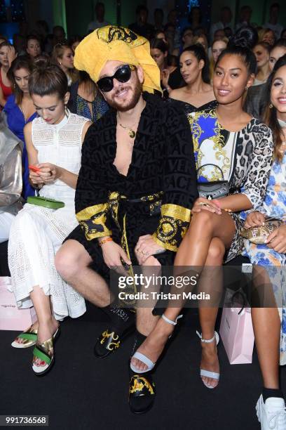 Riccardo Simonetti and Anuthida Ploypetch attend the Riani show during the Berlin Fashion Week Spring/Summer 2019 at ewerk on July 4, 2018 in Berlin,...