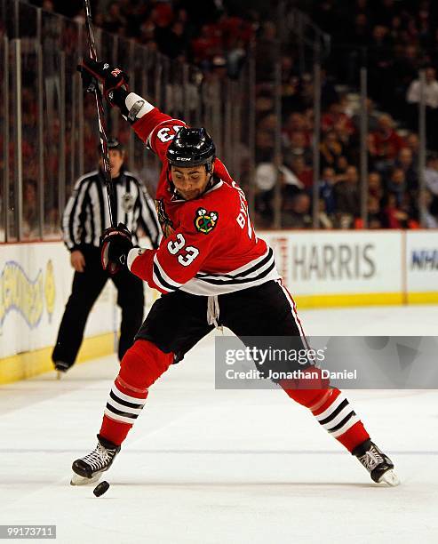 Dustin Byfuglien of the Chicago Blackhawks shoots the puck against the Columbus Blue Jackets at the United Center on January 14, 2010 in Chicago,...