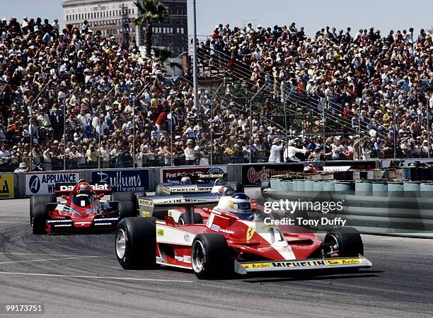 Carlos Reutemann drives the Scuderia Ferrari 312T3 ahead of Niki Lauda in the Parmalat Racing Team Brabham Alfa Romeo BT46 during the United States...