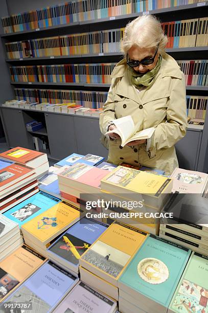 Visitor looks at books at the Turin International book fair on May 13, 2010. India is the guest country of the 2010 Salone internazionel del Libro...