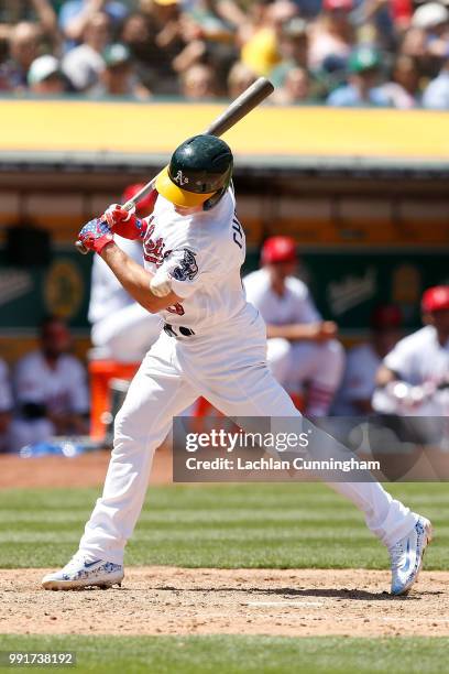 Matt Chapman of the Oakland Athletics is hit by a pitch in the sixth inning against the San Diego Padres at Oakland Alameda Coliseum on July 4, 2018...