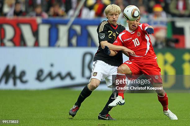 Andreas Beck of Germany challenges Andrew Cohen of Malta during the international friendly match between Germany and Malta at Tivoli stadium on May...