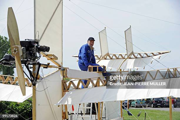 Member of "Flyersteam" old aircraft association Marc Bulin poses on a replica of French first seaplane named "Le Canard" , on May 13, 2010 in...