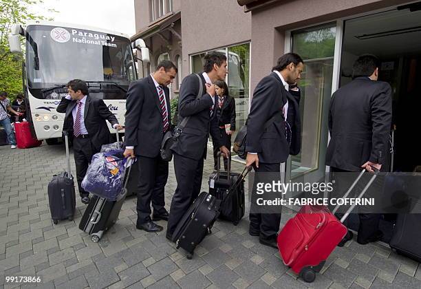 Members of the Paraguay's football team enter the hotel as the arrive on May 13, 2010 in Chexbres. Paraguay starts their preparation camp in...