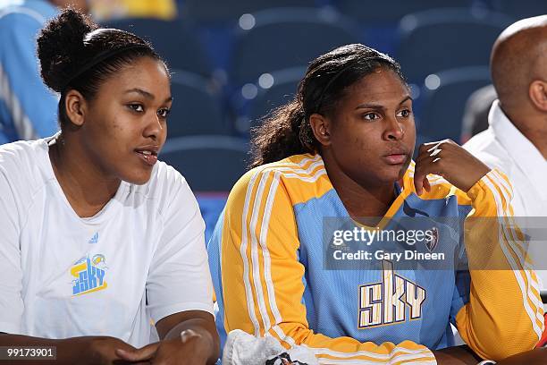 Abi Olajuwon and Courtney Paris of the Chicago Sky watch from the bench during the WNBA preseason game against the Indiana Fever on May 10, 2010 at...