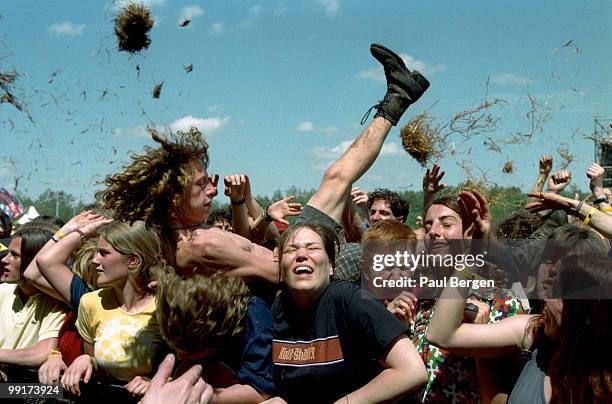 View of crowds and audience and crowd surfers at the Pinkpop Festival, Landgraaf in the Netherlands on May 18 1997