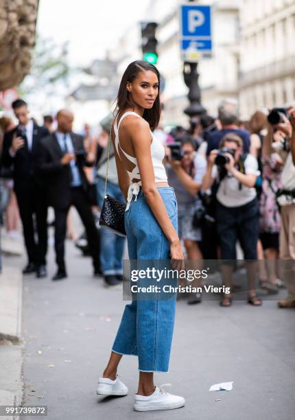 Model Cindy Bruna is seen outside Elie Saab on day four during Paris Fashion Week Haute Couture FW18 on July 4, 2018 in Paris, France.