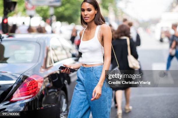 Model Cindy Bruna is seen outside Elie Saab on day four during Paris Fashion Week Haute Couture FW18 on July 4, 2018 in Paris, France.