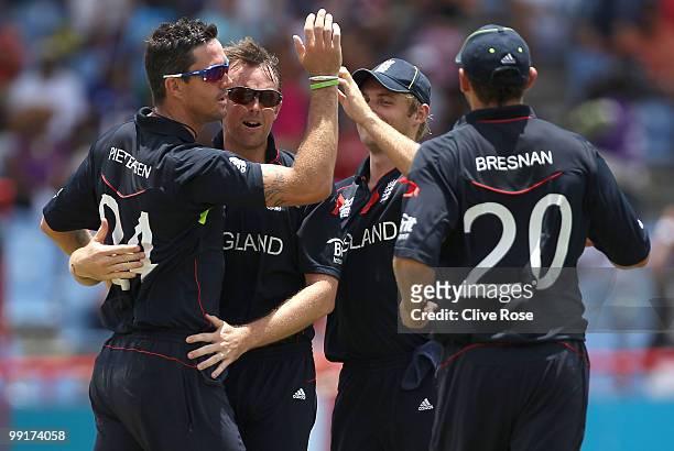 Graeme Swann of England celebrates with Kevin Pietersen after taking the wicket of Kumar Sangakkara of Sri Lanka during the semi final of the ICC...
