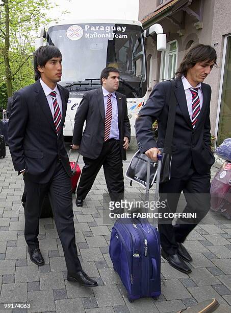 Paraguay's football team players Marcelo Estigarribia and Aureliano Torres enter the hotel upon their arrival on May 13, 2010 in Chexbres. Paraguay...