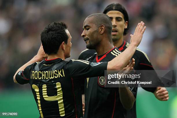 Cacau of Germany celebrates the first goal with Piotr Trochowski of Germany during the international friendly match between Germany and Malta at...