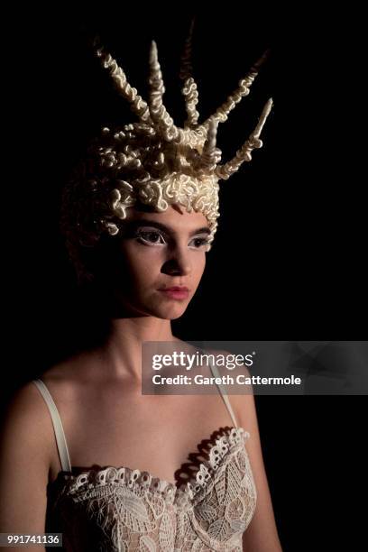 Elena Berbinau is made up backstage prior the Franck Sorbier Haute Couture Fall Winter 2018/2019 show as part of Paris Fashion Week on July 4, 2018...