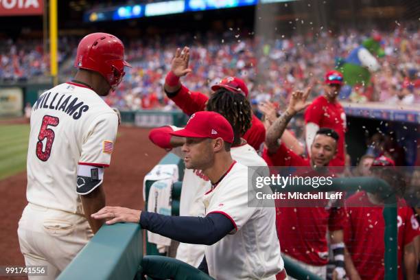 Nick Williams of the Philadelphia Phillies celebrates hitting his two run home run with manager Gabe Kapler in the bottom of the seventh inning...