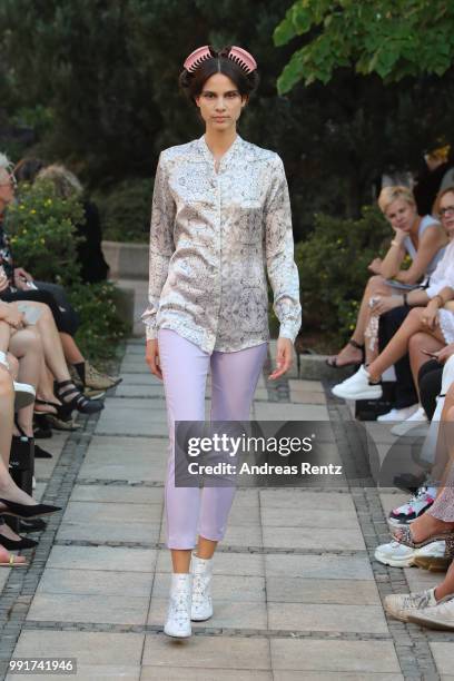 Model walks the runway at the Marcel Ostertag show during the Berlin Fashion Week Spring/Summer 2019 at Westin Grand Hotel on July 4, 2018 in Berlin,...