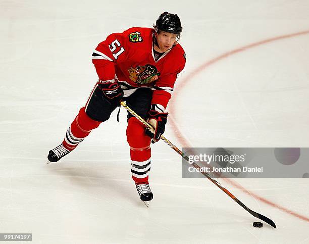 Brian Campbell of the Chicago Blackhawks looks to pass against the Nashville Predators at the United Center on December 4, 2009 in Chicago, Illinois....