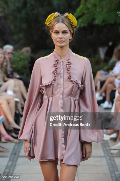 Model walks the runway at the Marcel Ostertag show during the Berlin Fashion Week Spring/Summer 2019 at Westin Grand Hotel on July 4, 2018 in Berlin,...