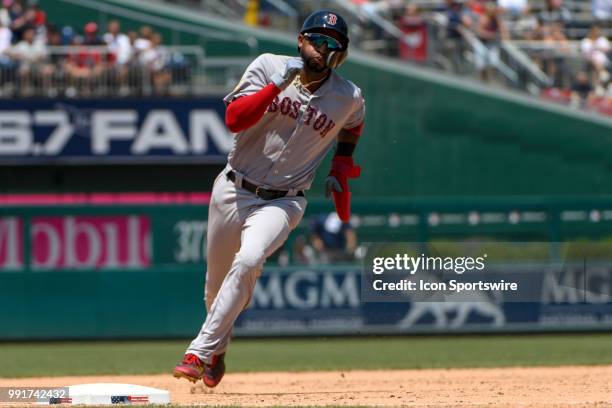 Boston Red Sox second baseman Eduardo Nunez rounds third base to score a run in the ninth inning during the game between the Boston Red Sox and the...