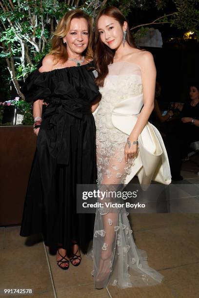 Caroline Scheufele and Jessica Jung attend amfAR Paris Dinner 2018 at The Peninsula Hotel on July 4, 2018 in Paris, France.