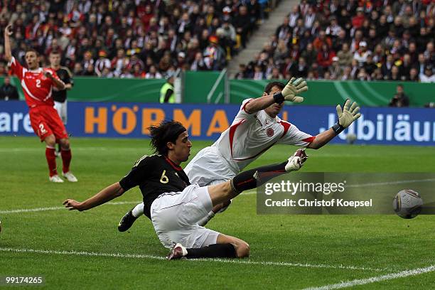 Serdar Tasci of Germany shoots the ball against Justin haber of Malta during the international friendly match between Germany and Malta at Tivoli...