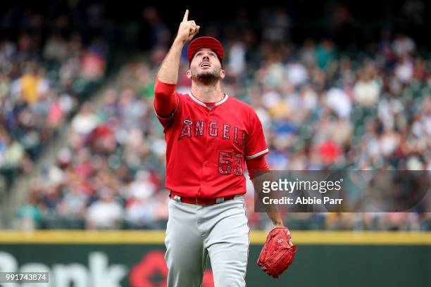 Blake Parker of the Los Angeles Angels of Anaheim celebrates after earning a save to defeat the Seattle Mariners 7-4 at Safeco Field on July 4, 2018...