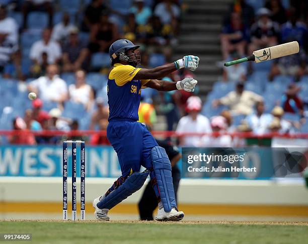 Chamara Kapugedera of Sri Lanka losses grip of his bat during the semi final of the ICC World Twenty20 between England and Sri Lanka at the Beausjour...